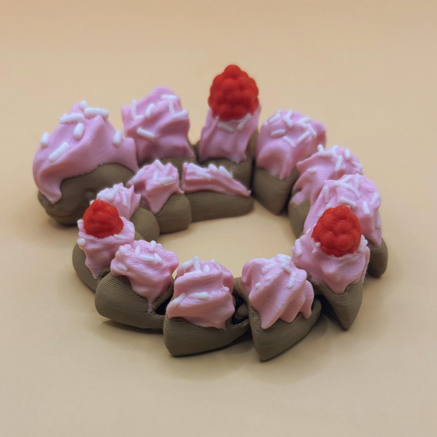 Slinkie Slice – The Cake-Themed Articulated Snake with Sweet Moves
