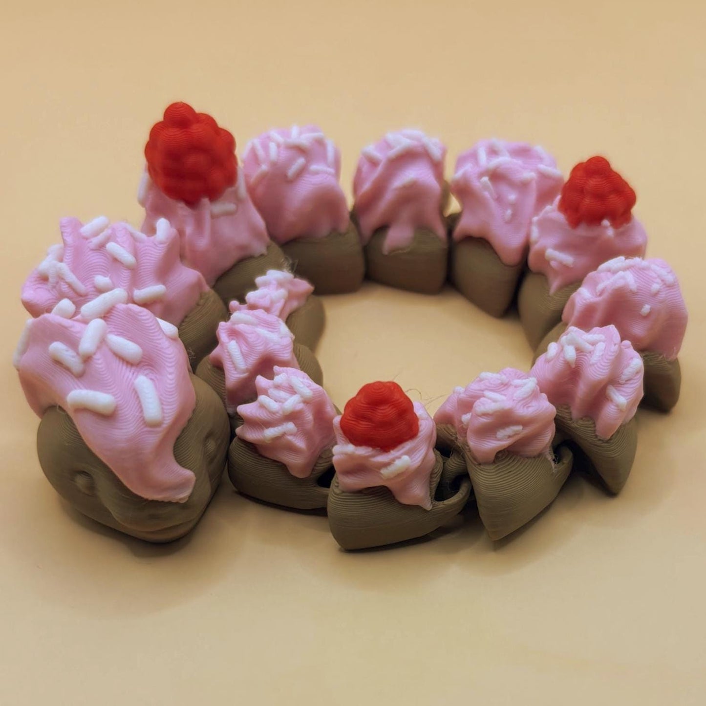 Slinkie Slice – The Cake-Themed Articulated Snake with Sweet Moves